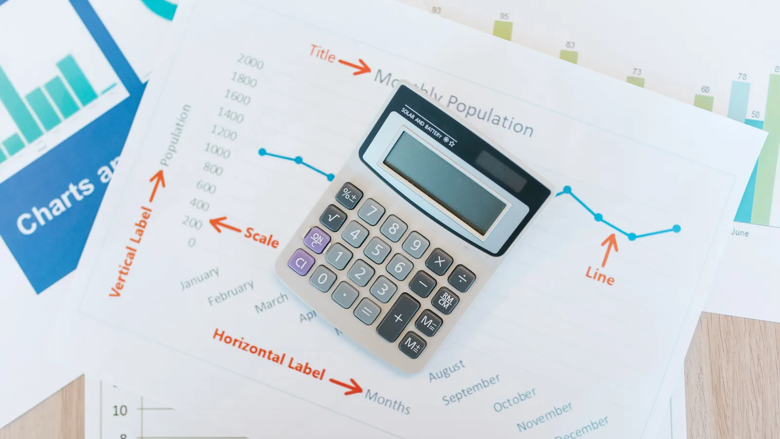 Calculator placed on financial documents showing mortgage structuring and repayment calculations