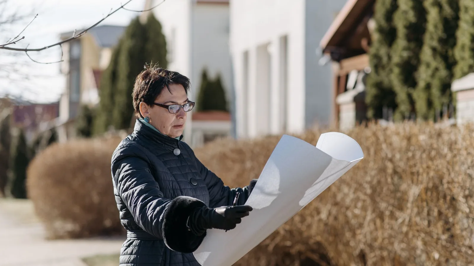Homeowner discussing property appraisal and equity valuation with professional adviser